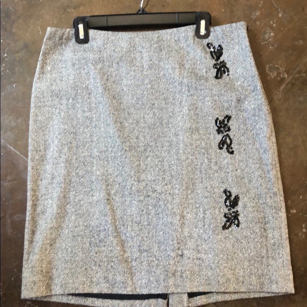 Worth skirt has subtle gold metallic threading